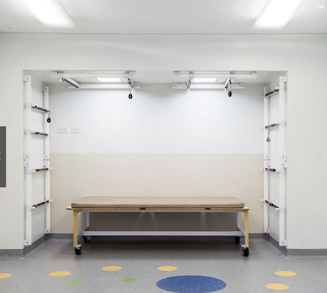 New parallel walking system with ceiling-mounted rail and coloured floor markers at Ciarec Clinic rehabilitation gymnasium